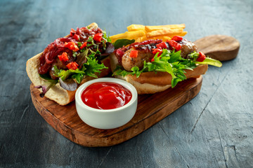 Cumberland sausage hot dogs with caramelized onion, roasted red peppers, french fries.