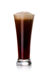 Beer glass filled with dark beer. Full glass with foam on white.