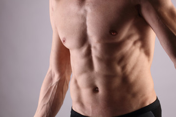 Fototapeta na wymiar Close up of muscular male torso, chest and armpit hair removal. Male Waxing