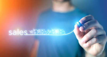 Concept of business success with arrow going up on a technology interface - Sales concept