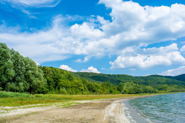 Photo of a beautiful beach near blue bay at summer