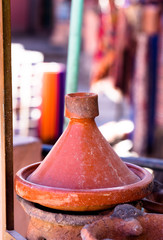 Handmade brown clay tajins for traditional food steaming on grill