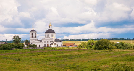 Rural landscape with white orthodox temple