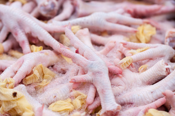 raw chicken paws sold on the market. Selective focus