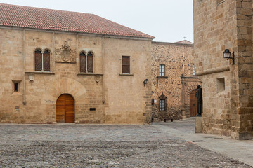 Square in old town of Caceres. Extremadura, Spain. A morning with fog.