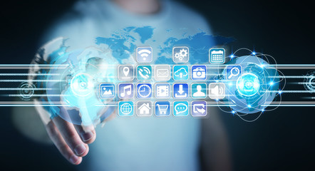 Businessman connecting worlds to icons and applications software 3D rendering