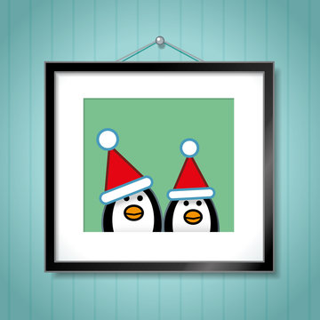Couple of Penguins Wearing Santa Hats in Picture Frame