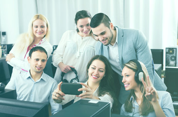 Fototapeta premium Friendly coworkers taking mutual photo