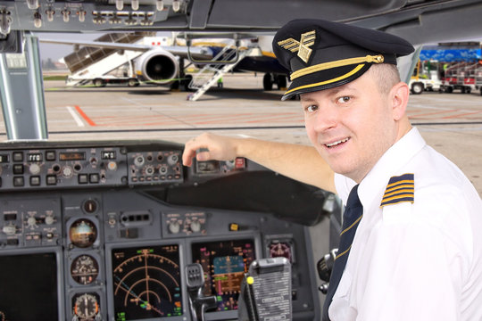 pilot in the cockpit of a plane on the board of the airport