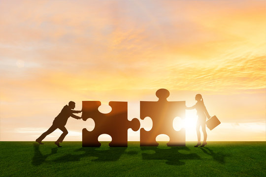 Business metaphor of teamwork with jigsaw puzzle