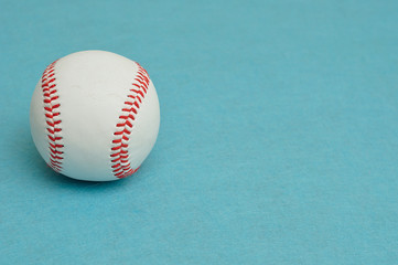 A baseball isolated on a blue background