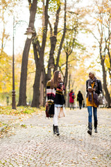 Fototapeta premium Multiracial female friends walking in teh autumn park