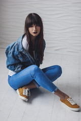 Portrait of beautiful girl dressing in 90s style fashion