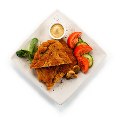 Fried pork chop and vegetables
