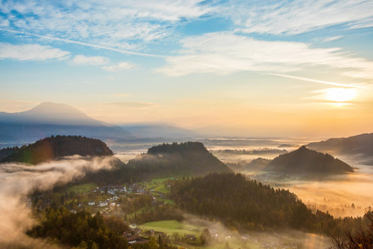 The charming landscape with fog in the valley in the mountains near Lake Bled in Slovenia, Europe