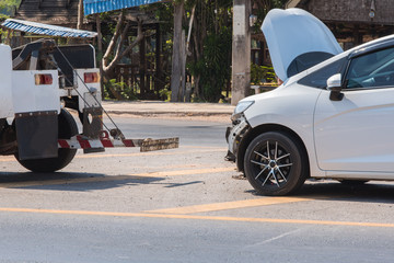 Car crash accident on road,Front of white car get damaged by accident on the road