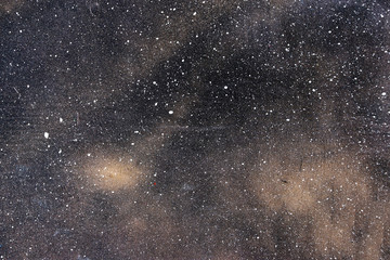 Pattern white on wooden wall black.