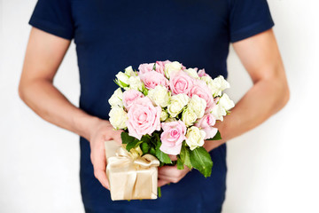 a man with red roses and valentine in the hands. valentine day love beautiful