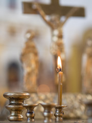 Church candles on the background of Christ's crucifixion