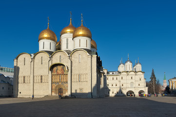 Fototapeta na wymiar Cathedral of the Assumption (1475 - 1479), the right of the Patriarch's Palace with the church Twelve Apostles (1653 - 1655), Cathedral Square of the Moscow Kremlin
