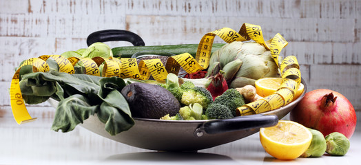 Vegetables, fruit, seeds, cereals, beans, spices, superfoods, herbs, condiment in silver pan for...