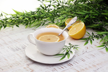 Tea. Herbal tea. Mint leaf. Tea in a glass cup, mint leaves, dried tea, sliced lime. herbs on a slate plate in a restaurant or teahouse