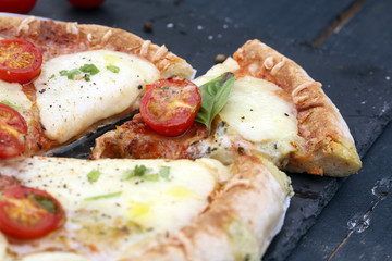 Hot true PEPPERONI ITALIAN PIZZA with salami and cheese. TOP VIEW Tasty traditional pepperoni pizza on board on wooden table with decoration