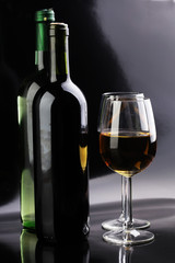 Wine glass and Bottle on black background. Red and white wine