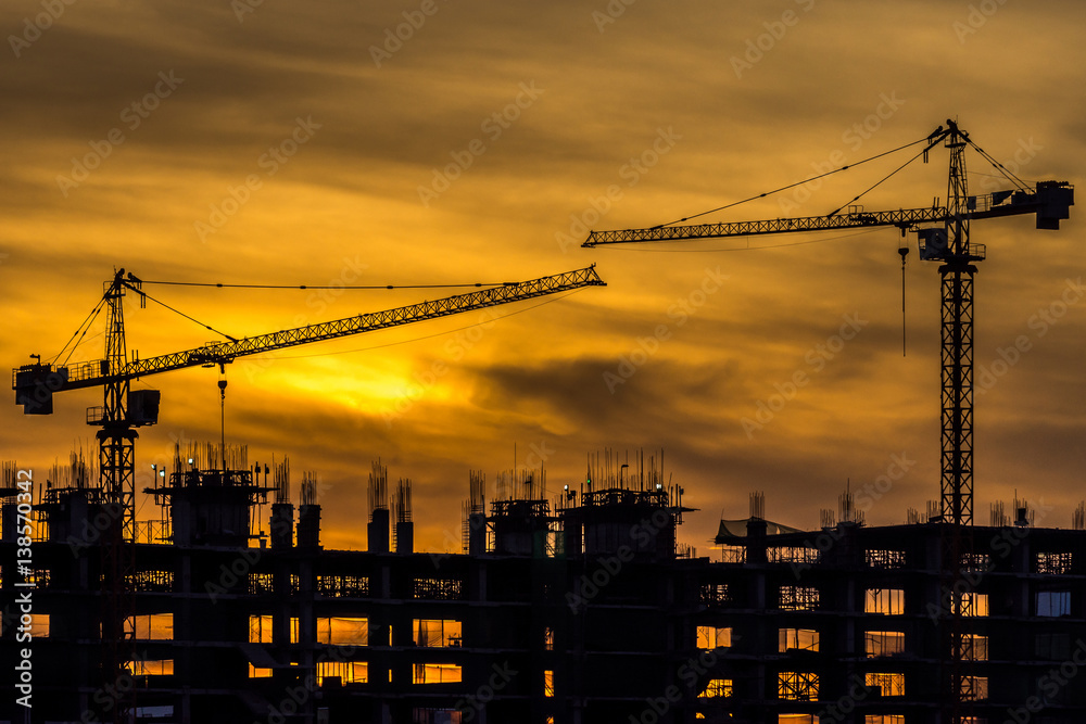 Wall mural silhouette of building and crane