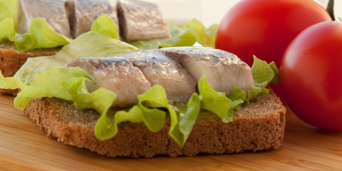 sandwich with herring and tomatoes