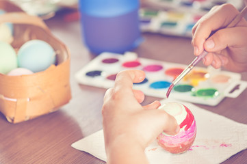 child paint eggs, holy Easter