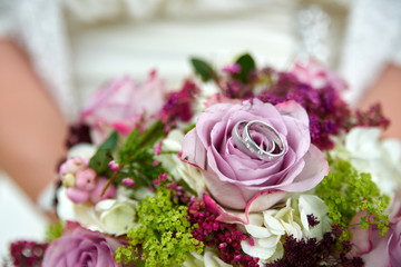 wedding bouquet with roses and rings