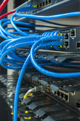 Network switch HUB and ethernet cables (LAN) in datacenter