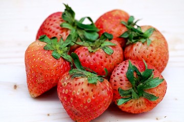 Red Strawberry Group on the Table Wood