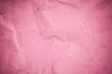 Fototapeta premium Pink crumpled recycle paper background.