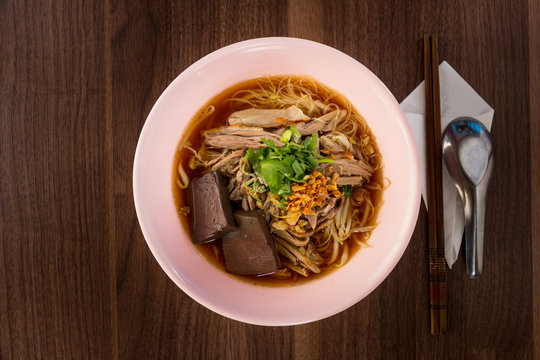 Thailand style duck noodle soup on wooded