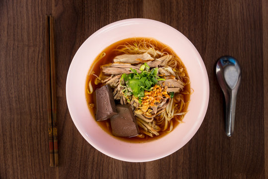 Thailand style duck noodle soup on wooded