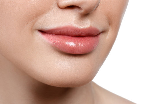 Perfect natural lip makeup. Close up macro photo with beautiful female mouth. Plump full lips. Beauty young woman Smile