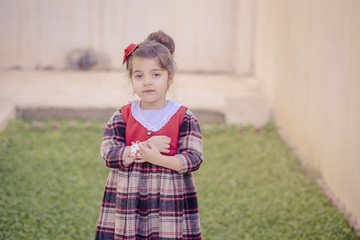 Small girl having fun inside garden