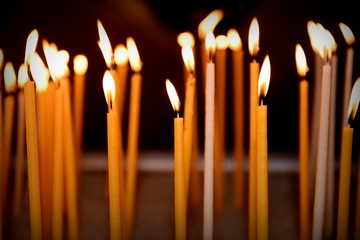 burning candles in church 