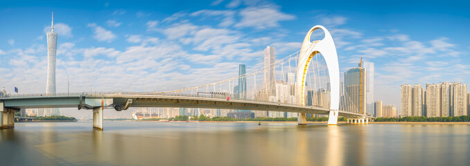 Panorama views modern bridge in Zhujiang River and modern building of financial district in...
