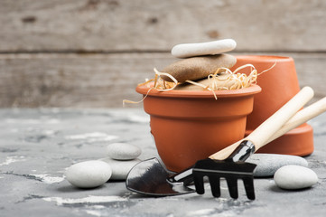 Gardening tools and clay terracotta flower pots