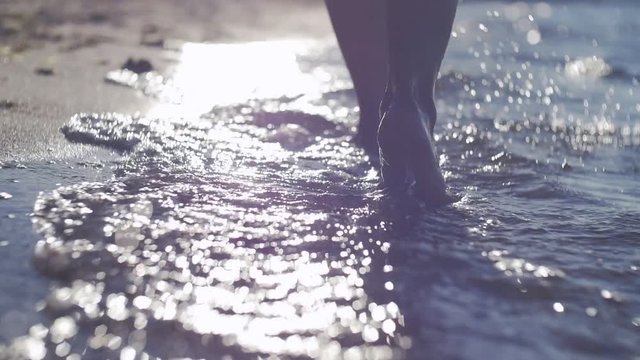 Foot stepping on the sea