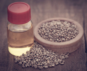 Seeds of Cannabis or hemp with essential oil in bottle