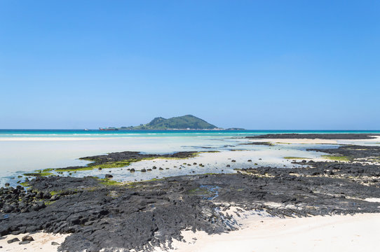 Geumneung beach at low tide and sunny day on Jeju island