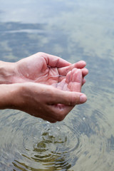 Holding water in cupped hands