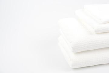 White cotton towels use in spa bathroom on the background.