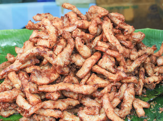 Fried pork placed on a banana leaf, Selective focus and Close up 