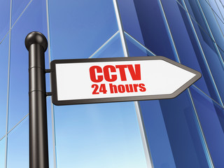 Safety concept: sign CCTV 24 hours on Building background