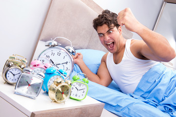 Man having trouble waking up in morning